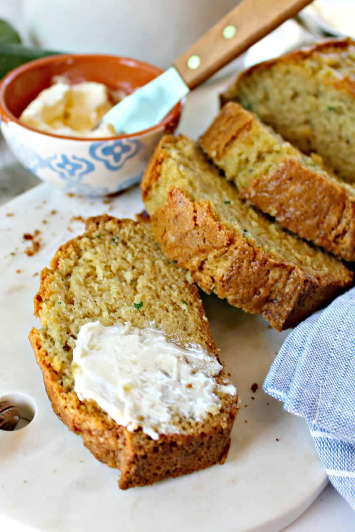 Close-up shot of a slice of moist squash and zucchini bread.