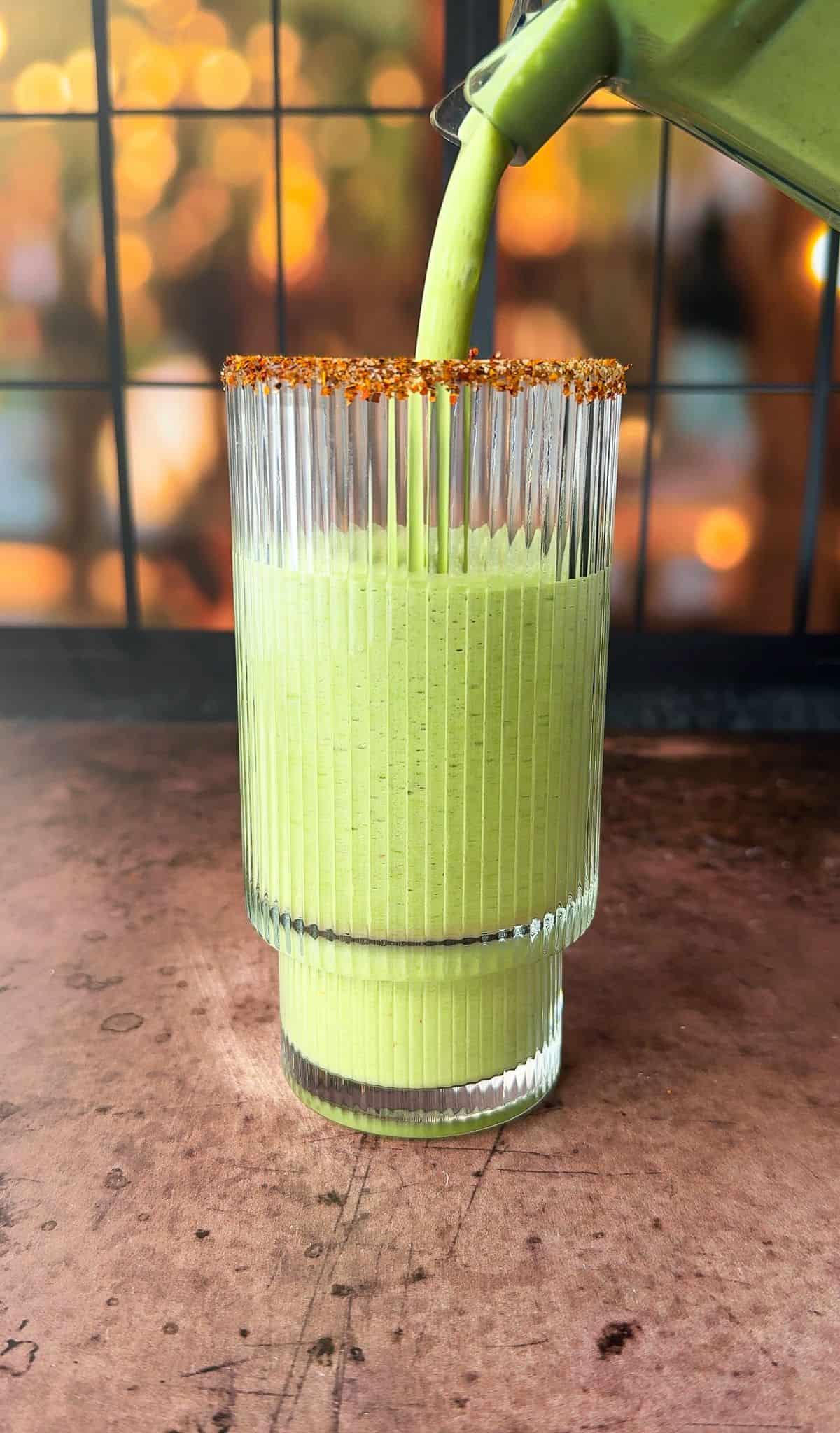 Refreshing key lime pie smoothie in a tall glass with a lime wedge