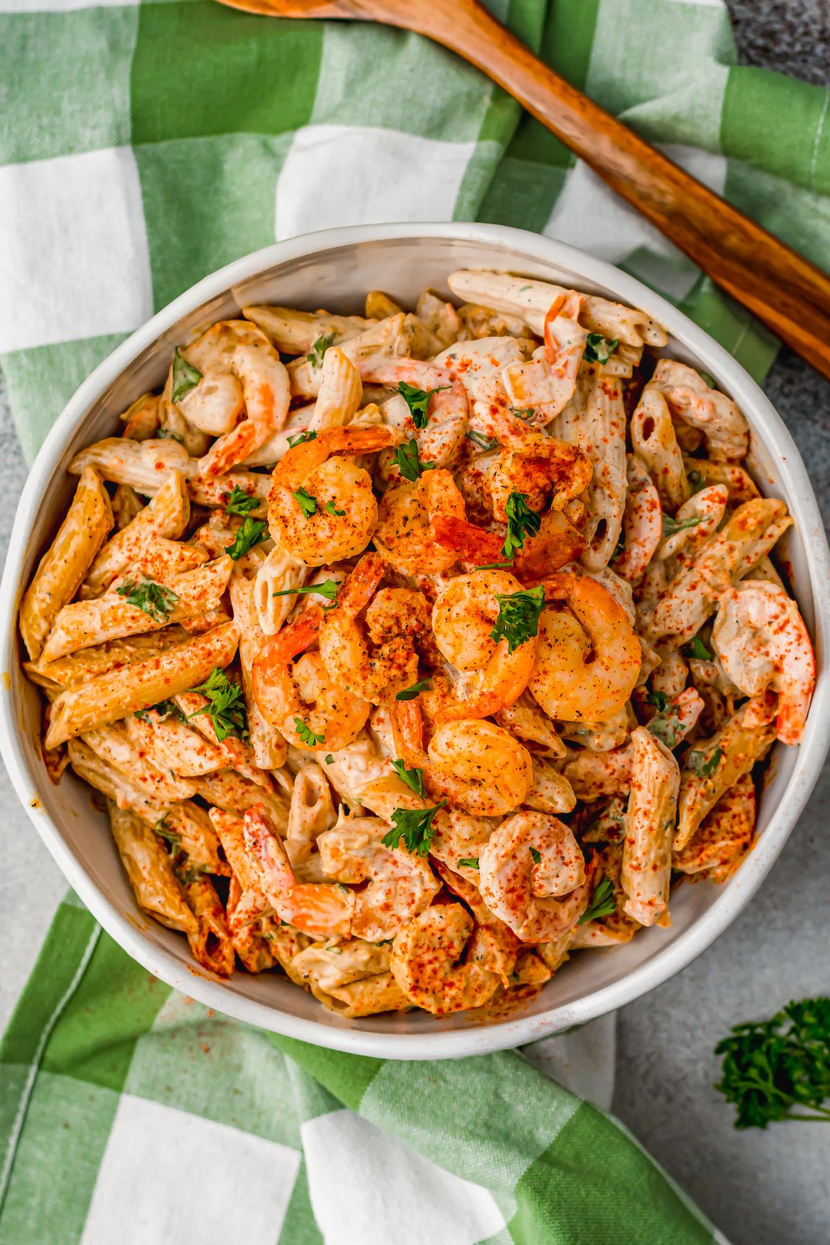 Overhead shot of a steaming plate of Cajun shrimp pasta