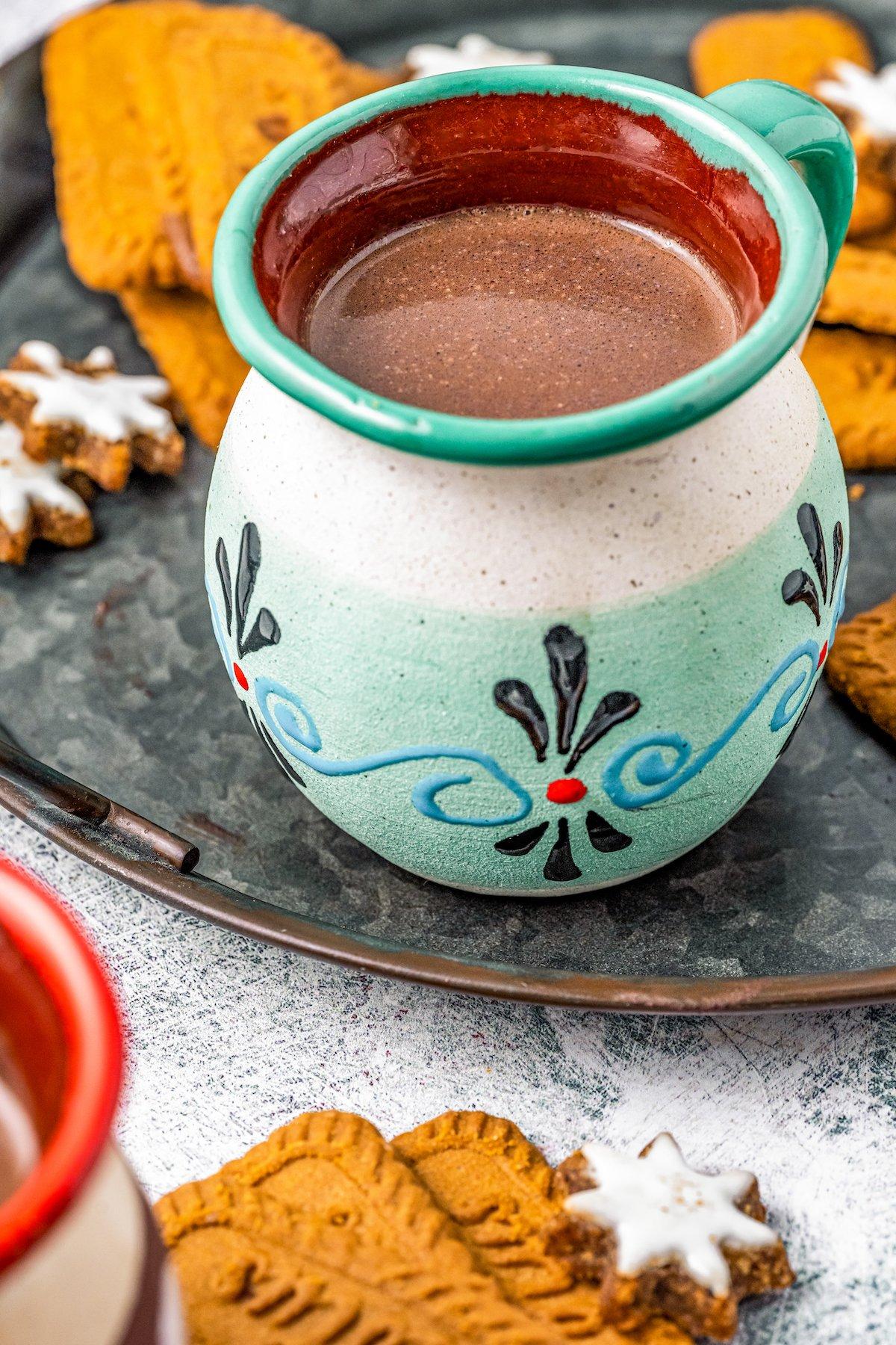 traditional Mexican hot chocolate prepared in a clay mug, steaming