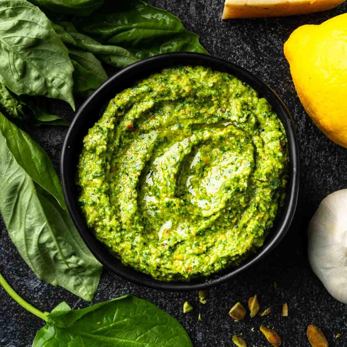 A close-up of the spinach pesto sauce, showing its vibrant green color and texture