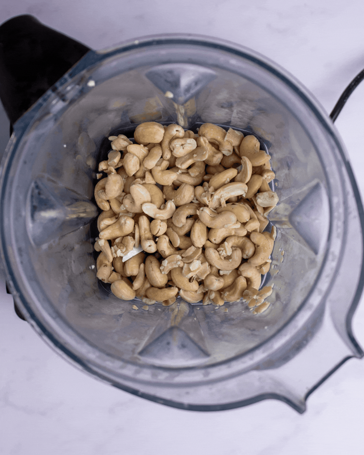 Cashew cream being blended in a high-speed blender