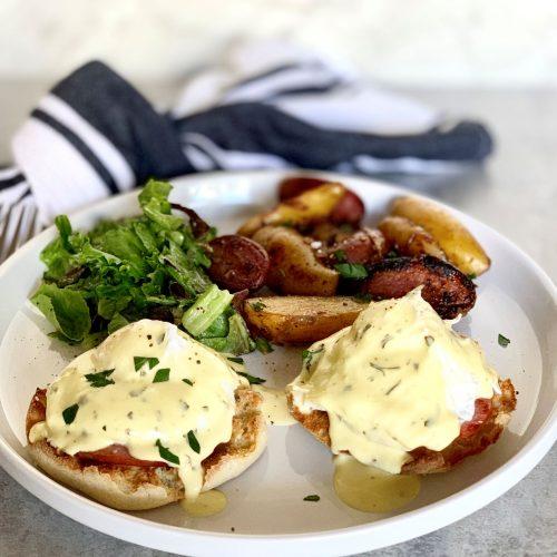 Eggs Benedict with a ghriba cookie base on a breakfast table