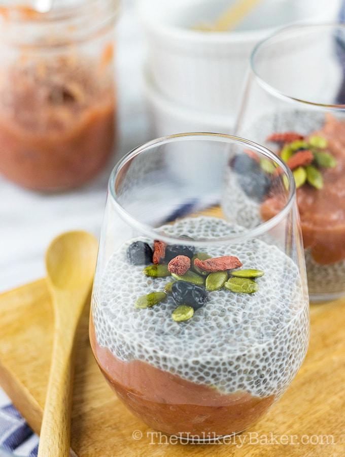 person eating butter pecan chia pudding with a spoon, smiling