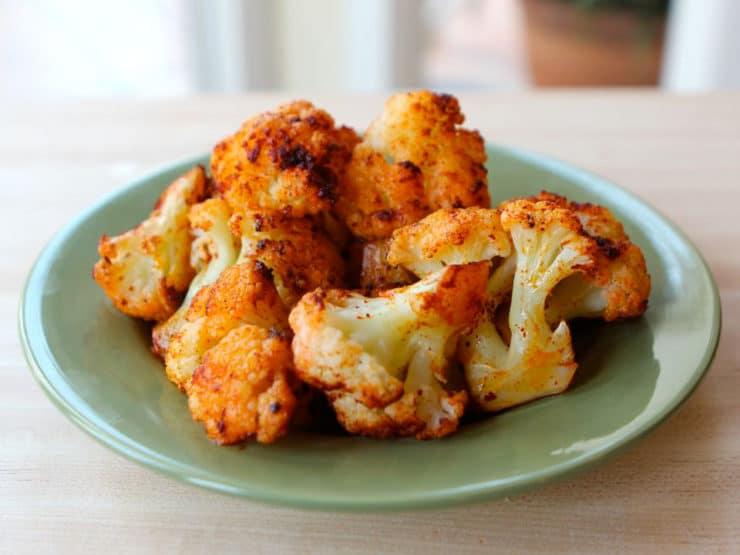Close up of smoky paprika BBQ cauliflower, showing the texture and char