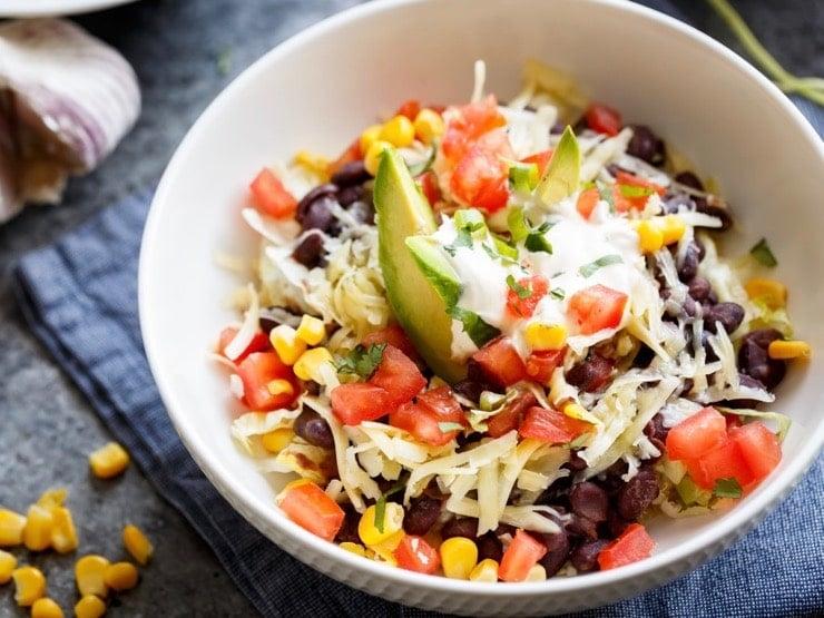 overhead shot of a colorful black bean burrito bowl
