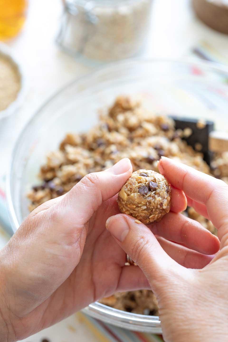 close up shot of someone mixing ingredients for energy bites