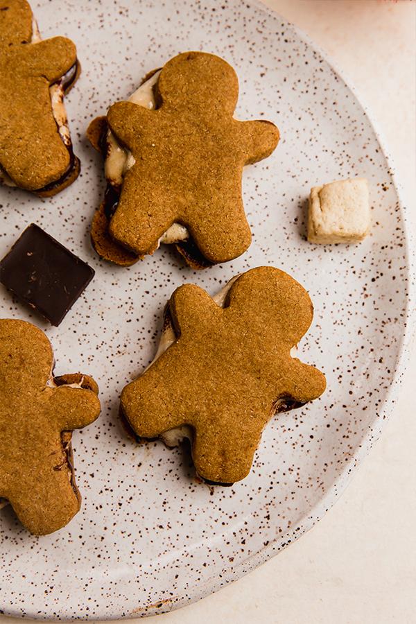 Close up shot of a single gingerbread s'more cookie, showcasing the texture and ingredients