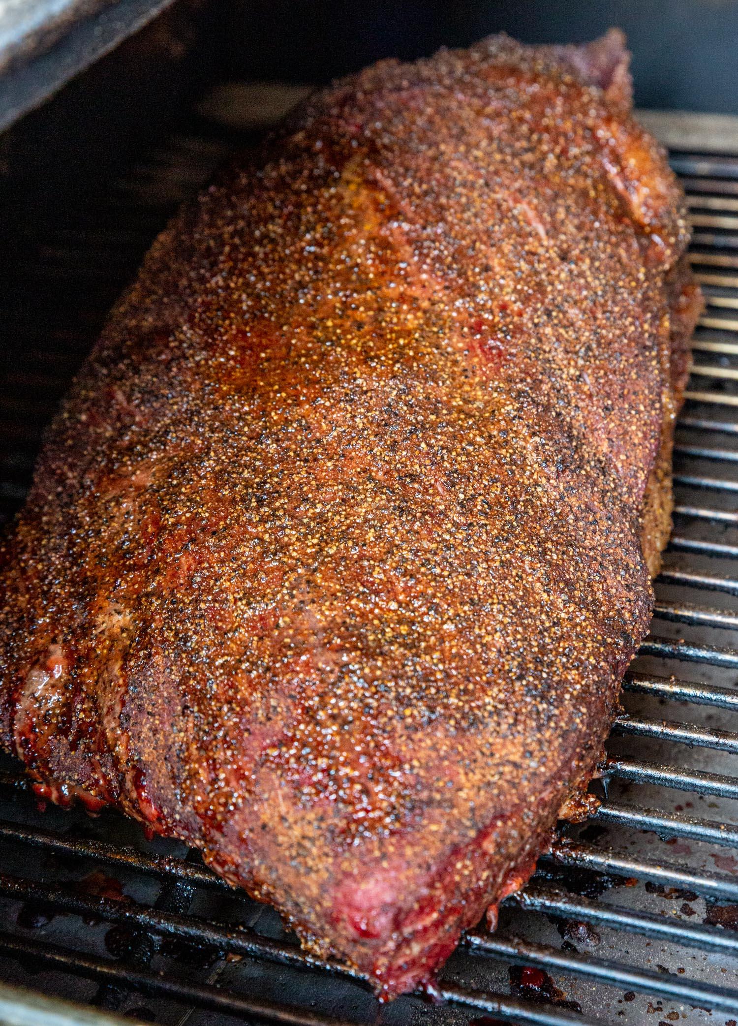 raw brisket with dry rub applied