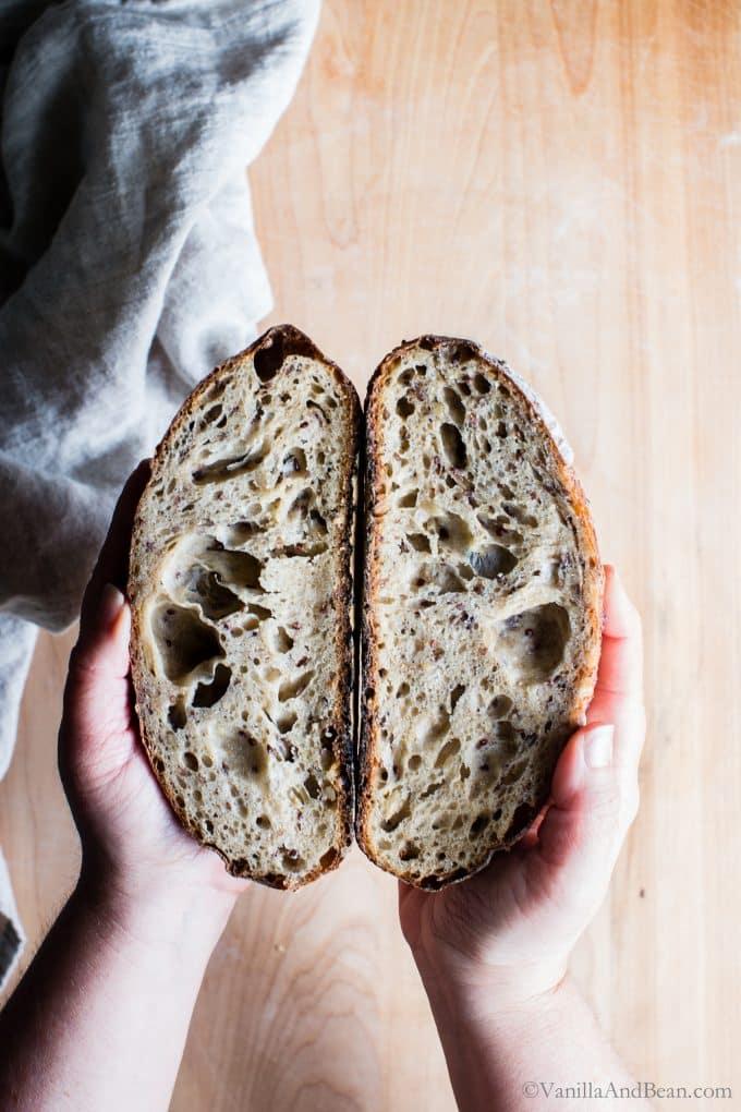 rustic loaf of multigrain sourdough bread with toasted seeds, close up