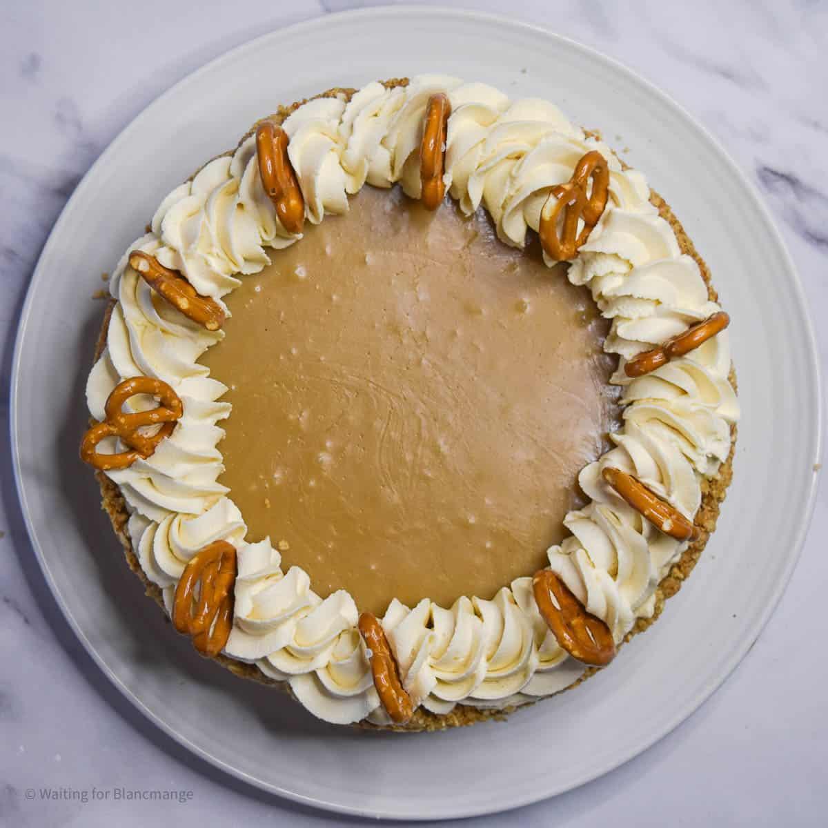 Overhead shot of a whole salted caramel pretzel cheesecake