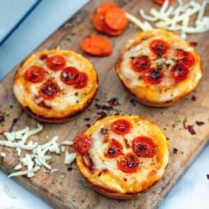 Close up shot of mini pizzas with chipotle mayo, showing the texture and toppings