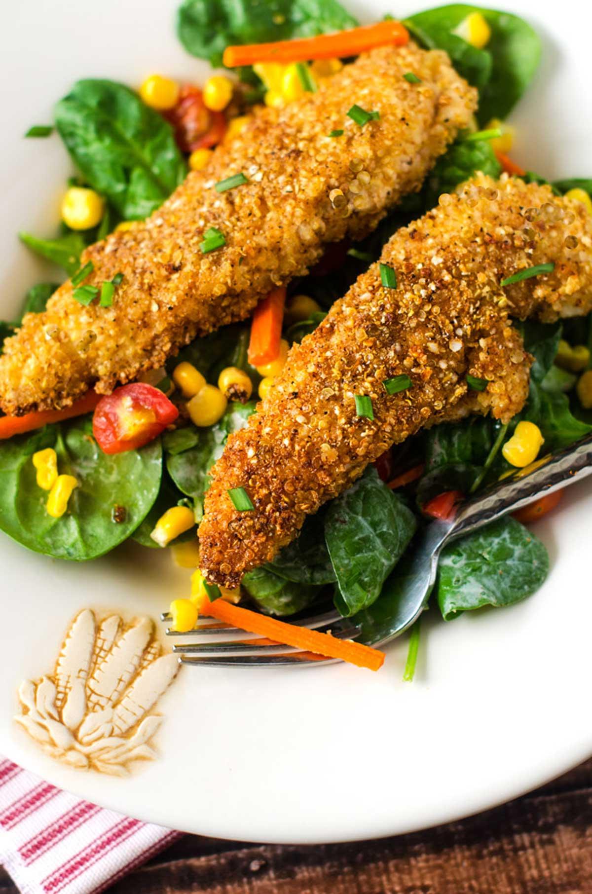 Close up of quinoa crusted fried chicken showing texture