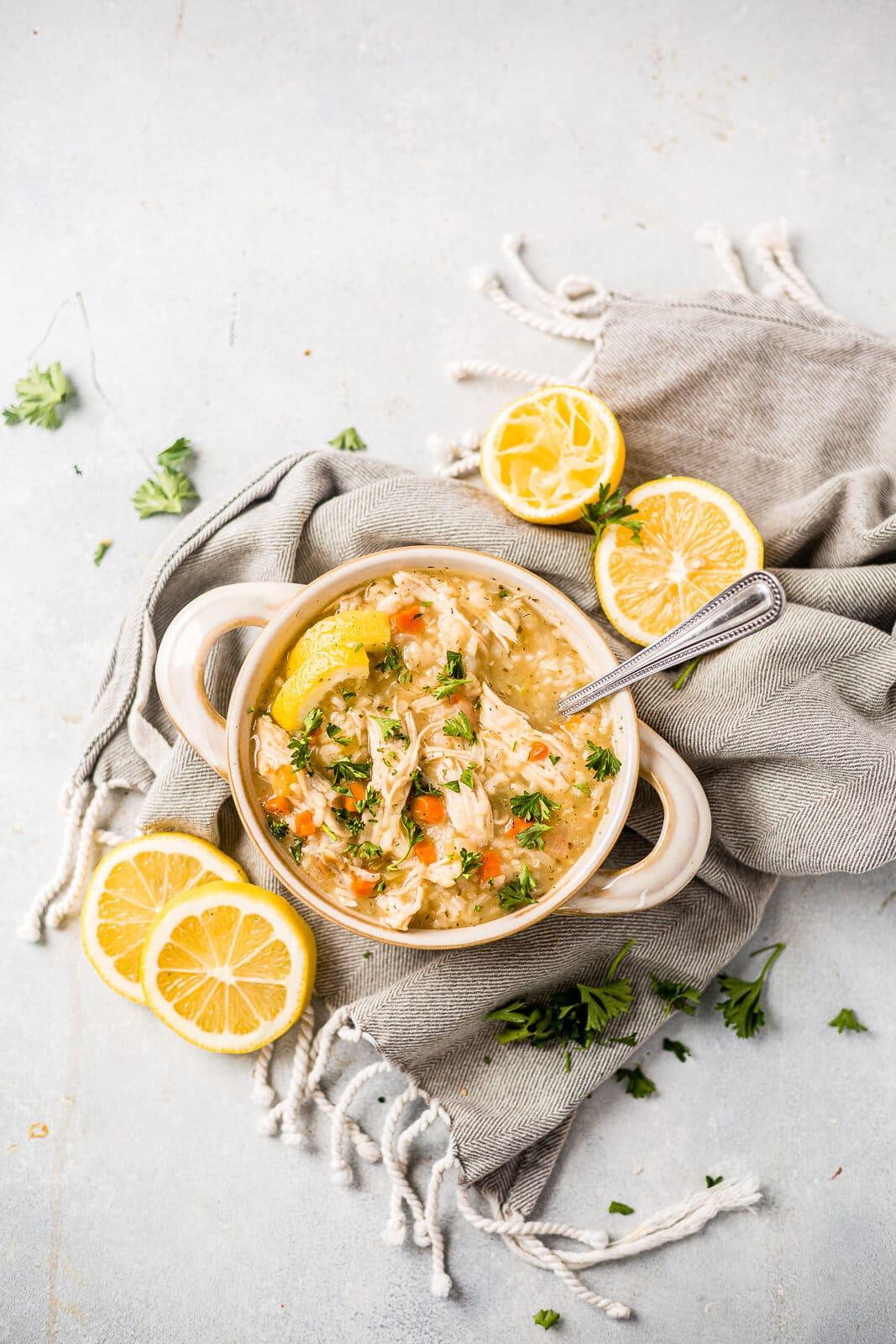 Close-up shot of Instant Pot Greek Lemon Chicken Stew with lemon slices