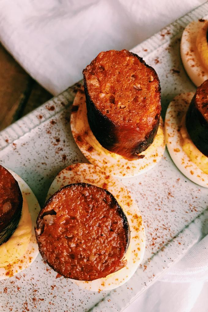 Close up of a single spicy chorizo and manchego deviled egg