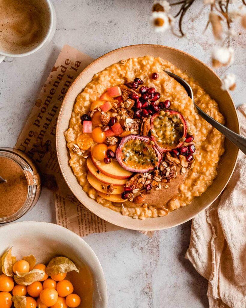 Person enjoying a bowl of pumpkin spice oatmeal