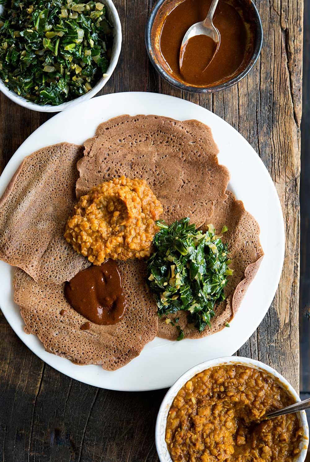 Close-up shot of Injera being infused with spiced butter