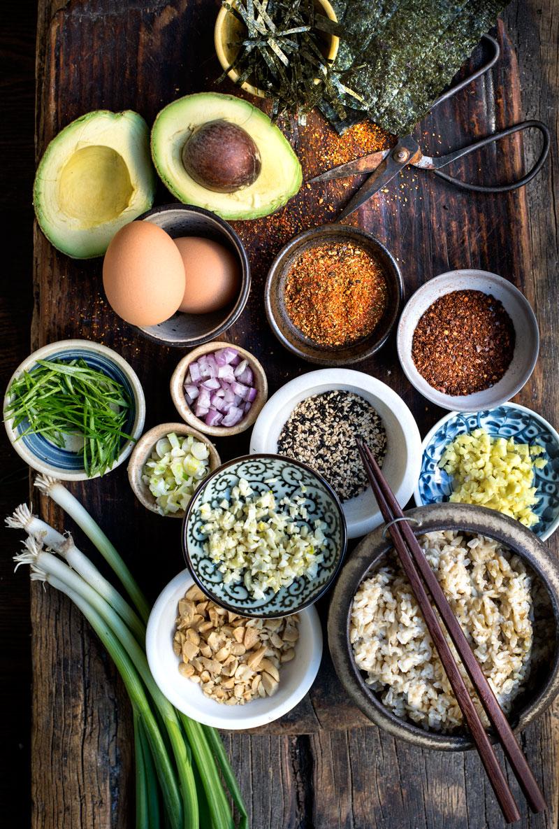 Overhead shot of a table setting with the Japanese Nanami Togarashi Chickpea Curry, rice, and various garnishes.