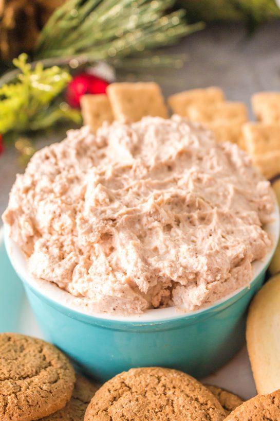 ingredients for cinnamon roll dip with cream cheese frosting arranged on a wooden countertop
