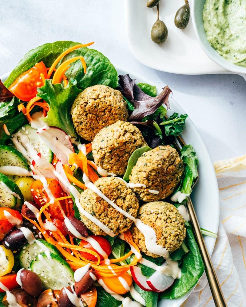 vibrant falafel and olive salad with oregano dressing, close up