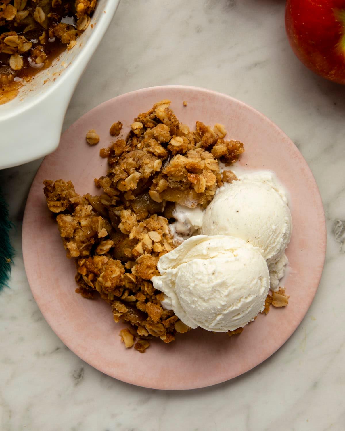a warm plantain and apple crumble with oatmeal topping being served in a cozy kitchen