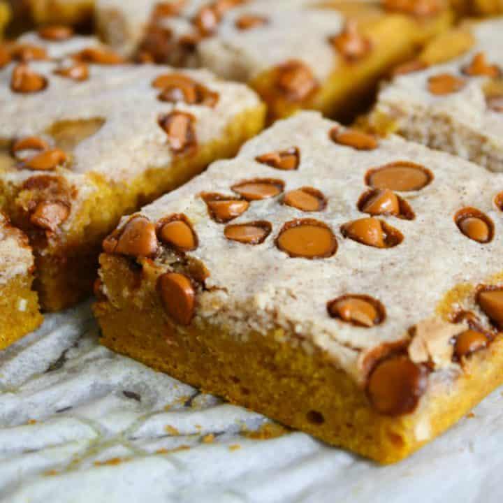 family enjoying cinnamon swirl pumpkin squares in a cozy cabin setting