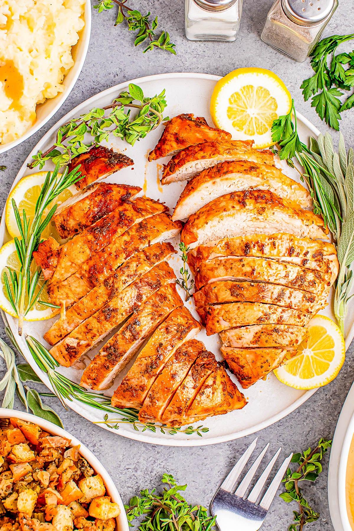 Pan-seared turkey breast with lemon butter sauce close-up, rustic background