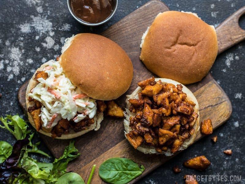 overhead shot of sriracha glazed tofu sliders on a wooden serving board