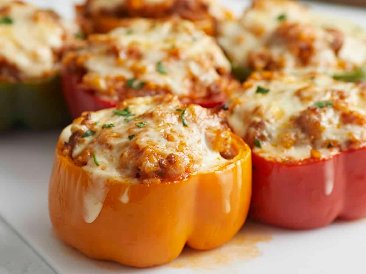 Close-up shot of a stuffed bell pepper being cut open to reveal the filling