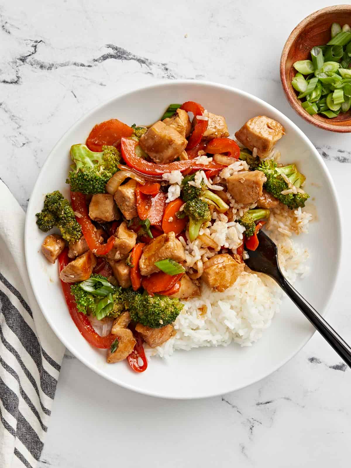 A vibrant and delicious Chicken Stir-Fry with Rice and Vegetables, ready to be served.
