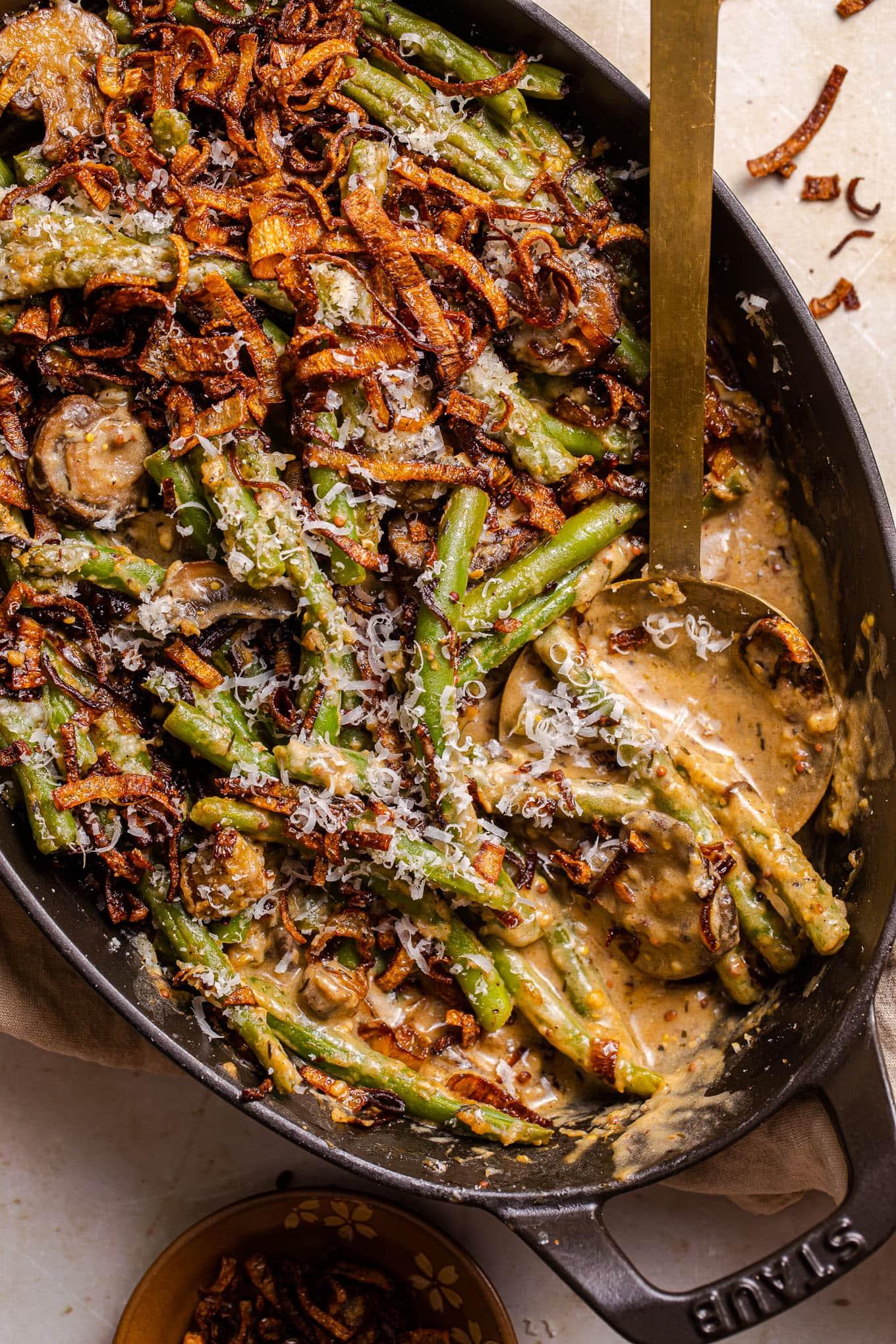 Homemade green bean casserole with fresh mushrooms, golden brown crispy topping