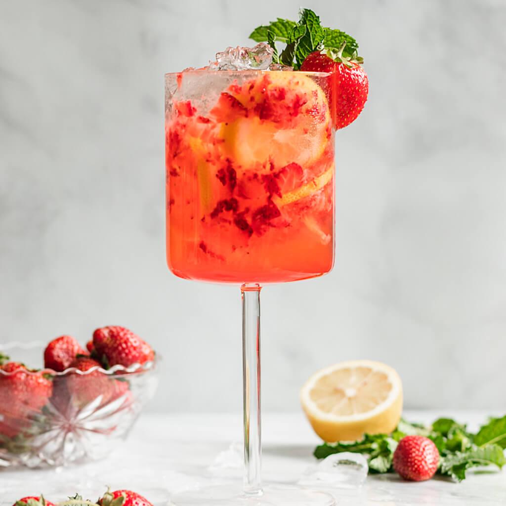 Close-up of muddled strawberries in a cocktail shaker