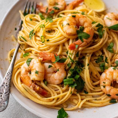 Close-up shot of Shawarma-Spiced Shrimp Scampi with Linguine, highlighting the vibrant colors and textures