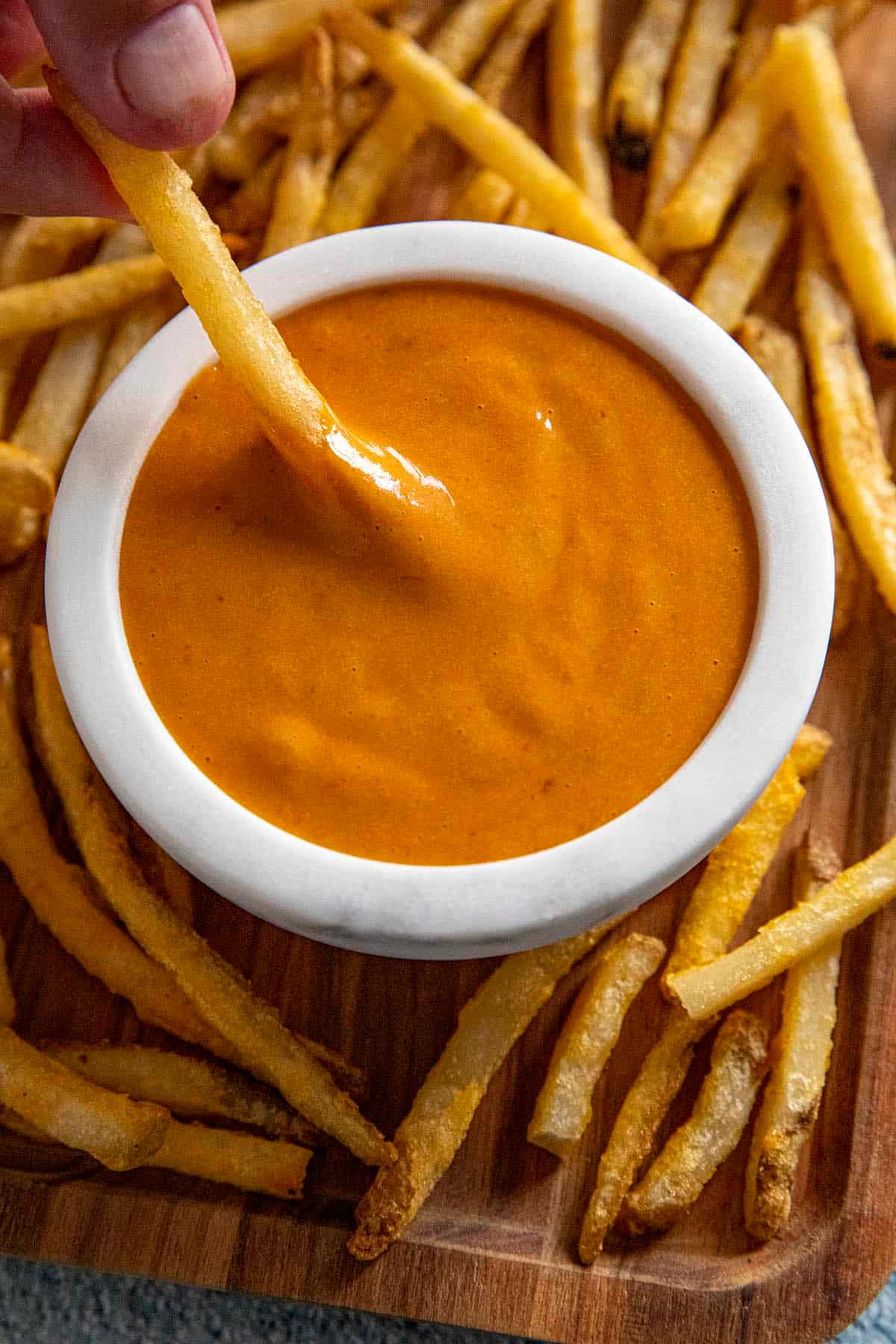 Close-up shot of the chipotle aioli, highlighting its creamy texture and vibrant color