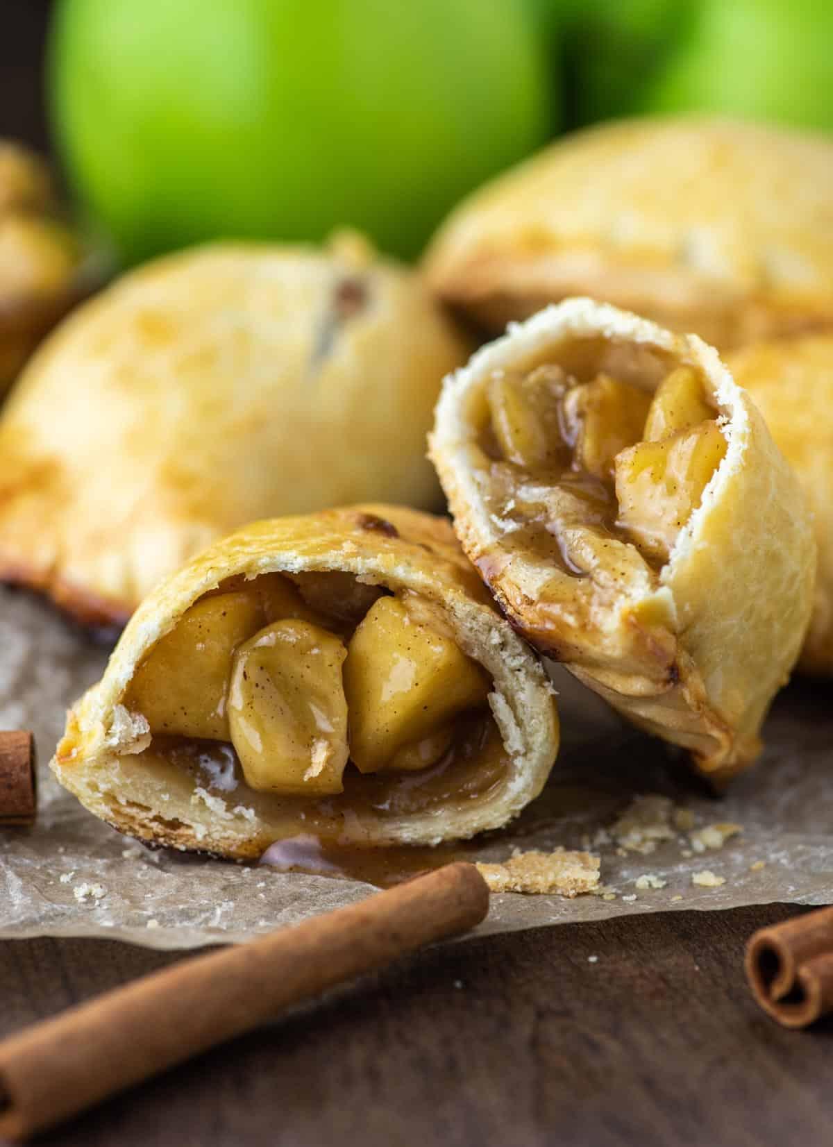 group of people enjoying apple pie empanadas at a party