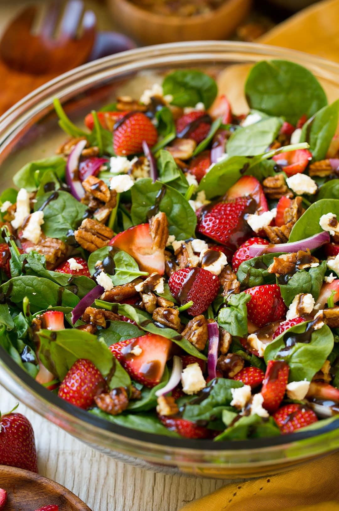 Close-up shot of a single serving of the Strawberry Spinach Salad with Candied Pecans
