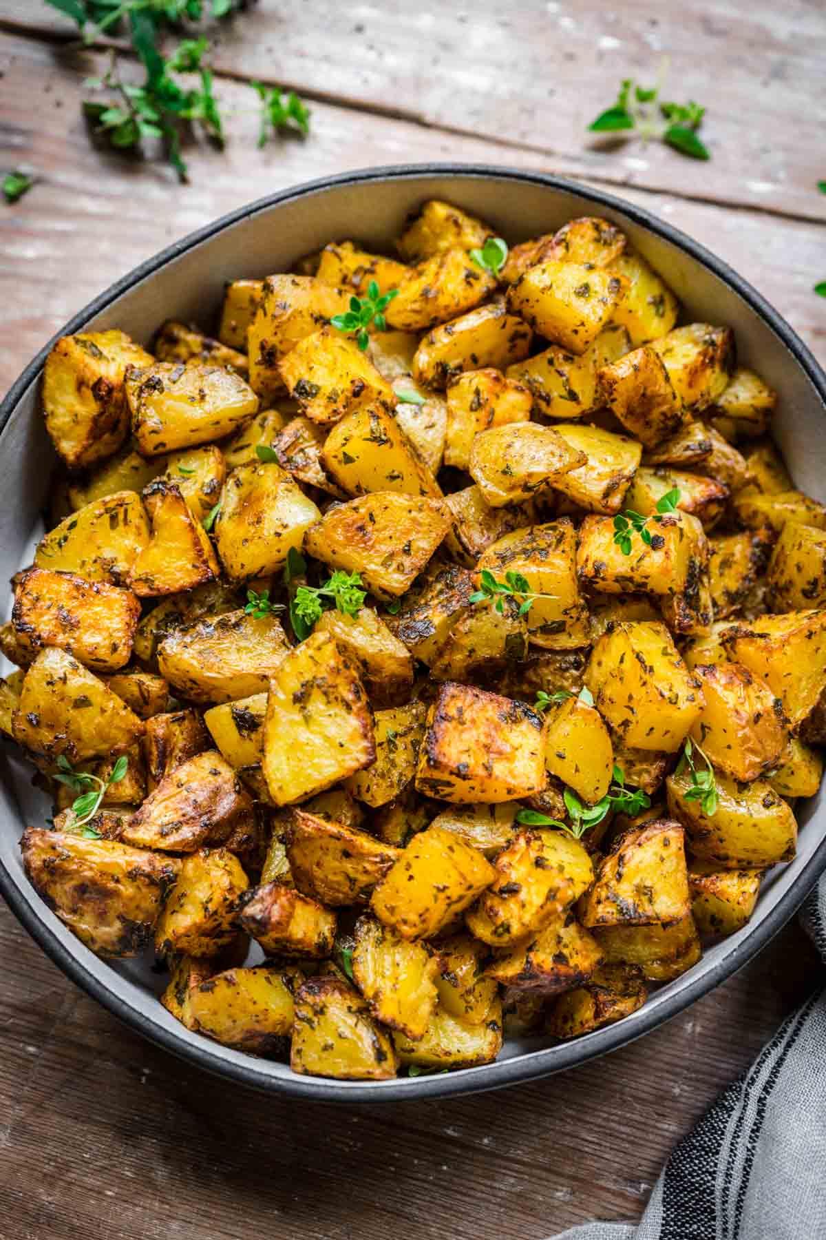 Close-up shot of sheet pan potatoes with herbs