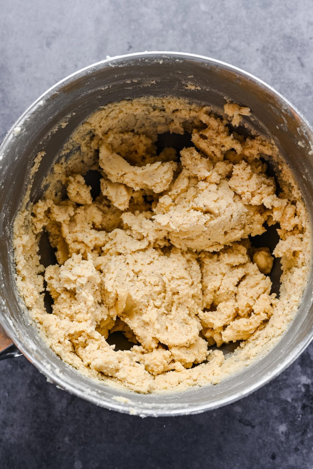 A bowl of cracker dough being mixed.