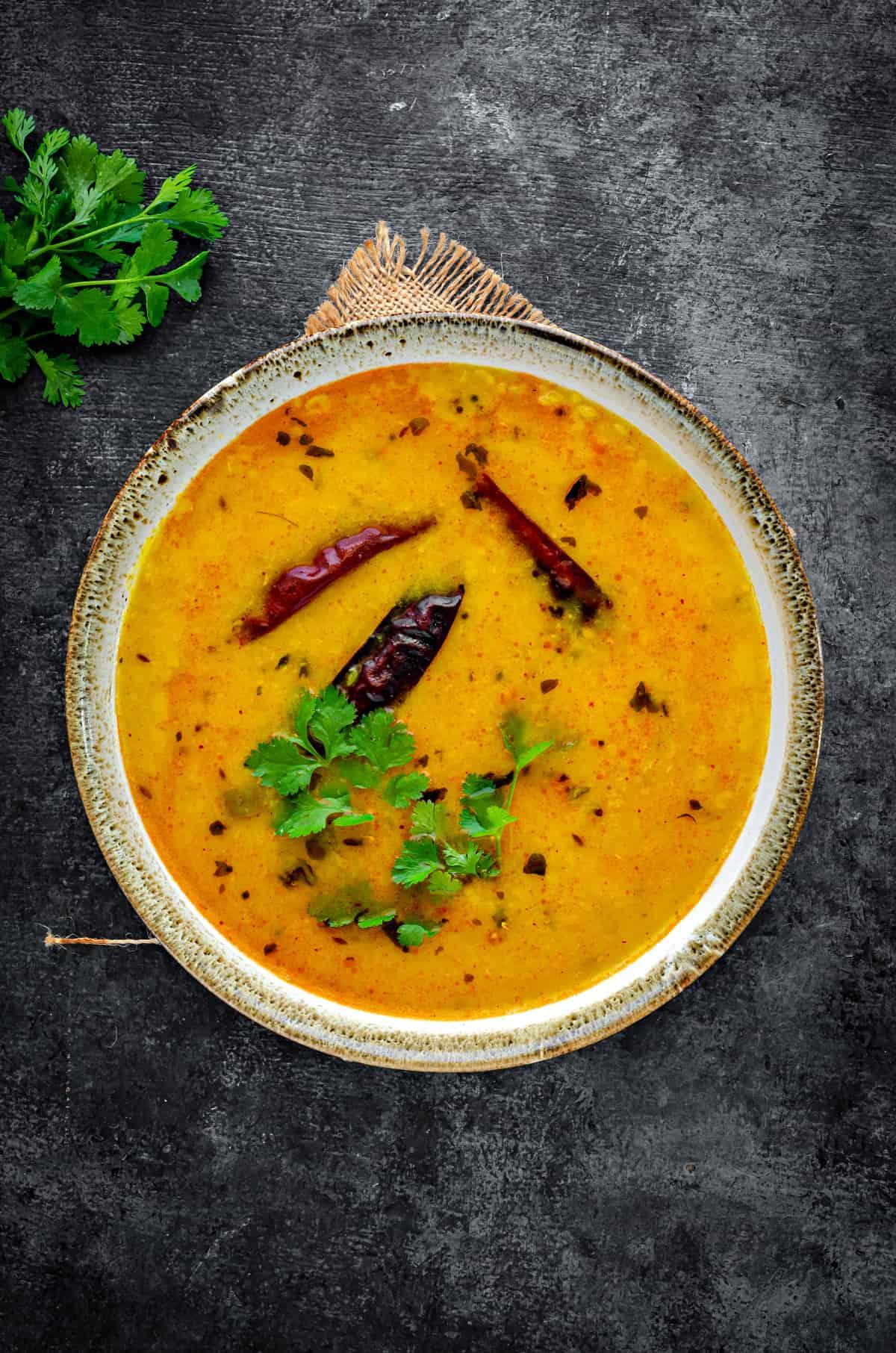 Close-up shot of a bowl of yellow lentil dal