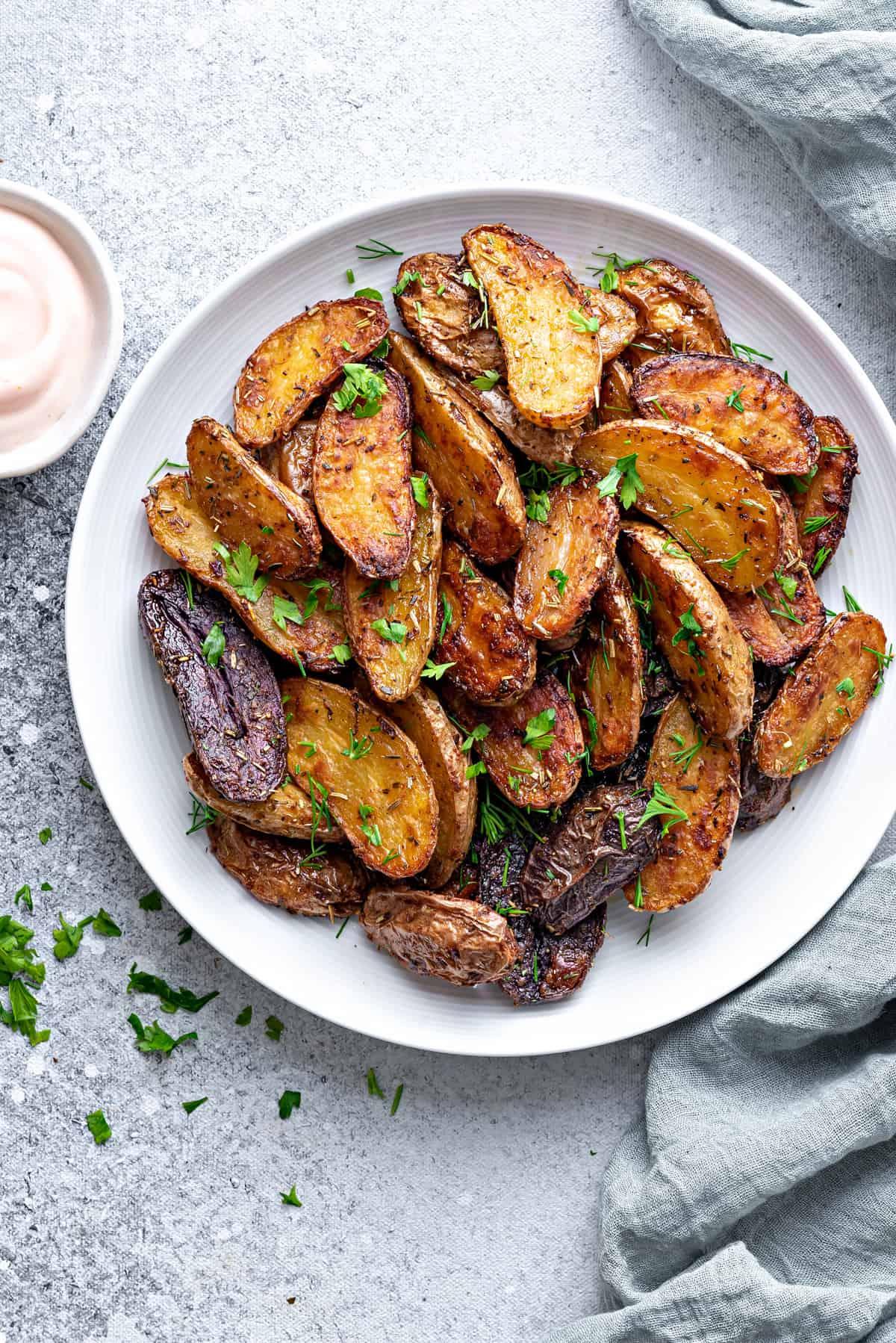 A close-up shot of the finished roasted fingerling potatoes, showcasing their texture and color.
