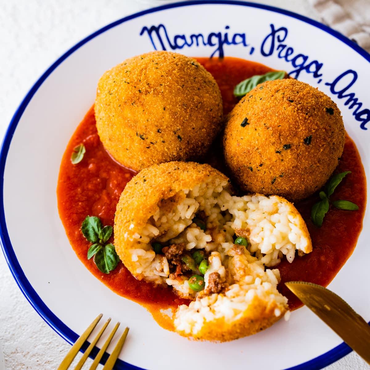 Close-up of a single Pizza Arancini, highlighting the texture and ingredients