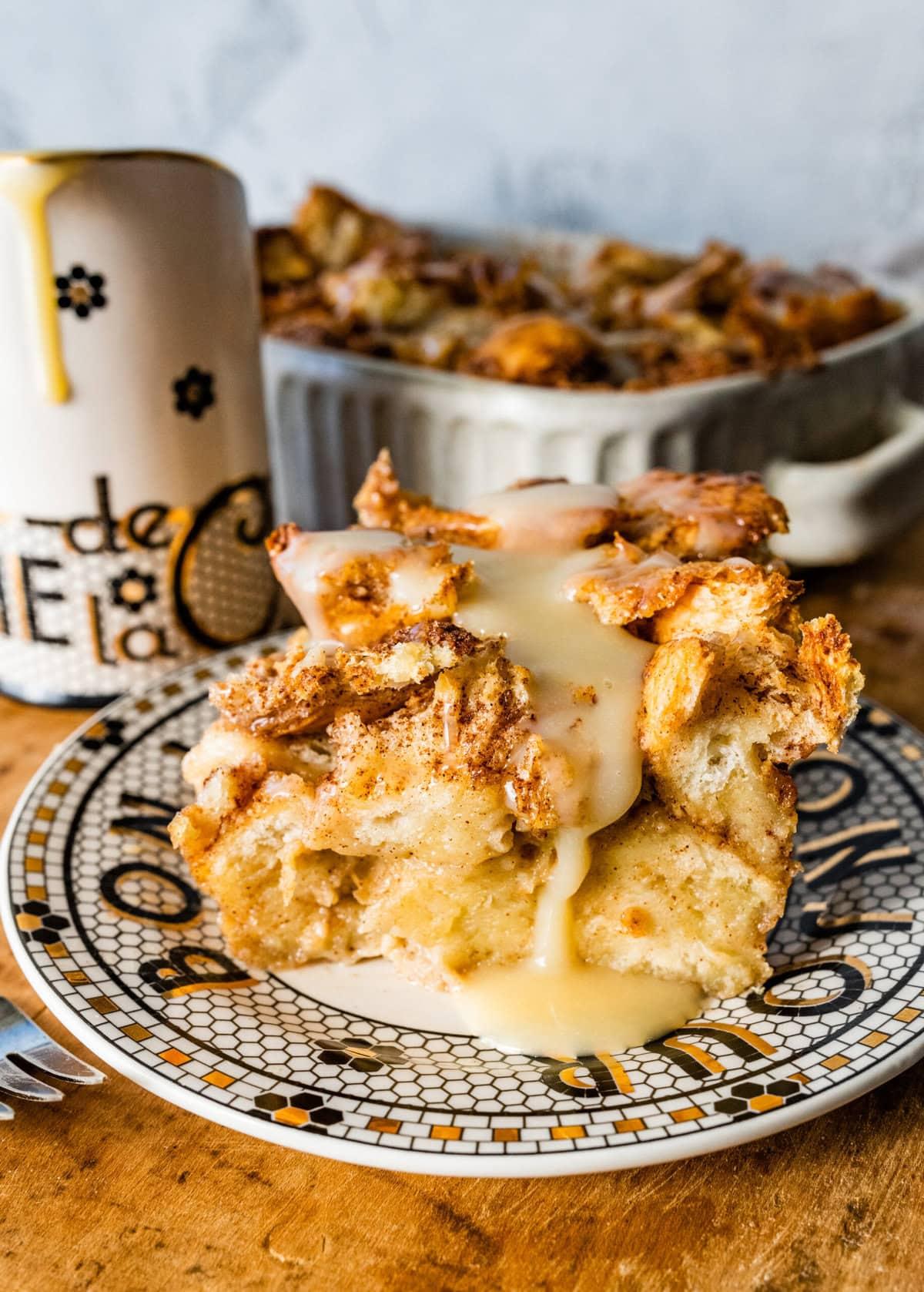 A rustic kitchen setting with a warm bread pudding on a table