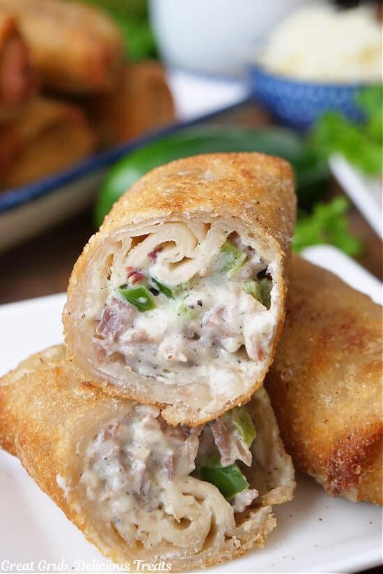 Close-up shot of crispy smoked brisket egg rolls on a baking sheet