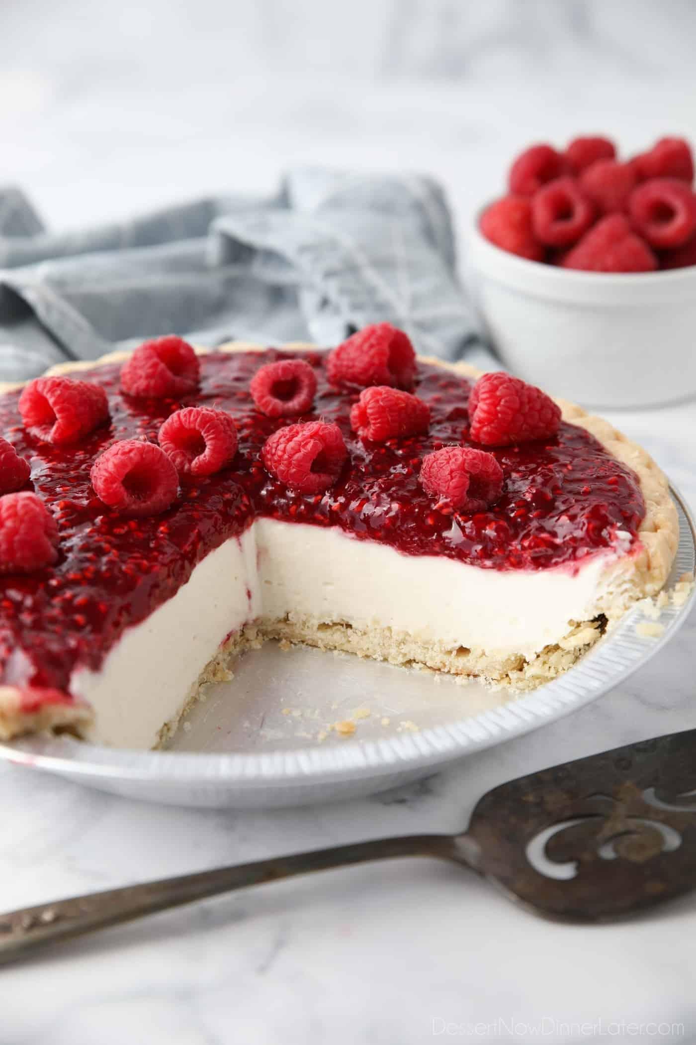 slice of raspberry cream pie with fresh raspberries on top