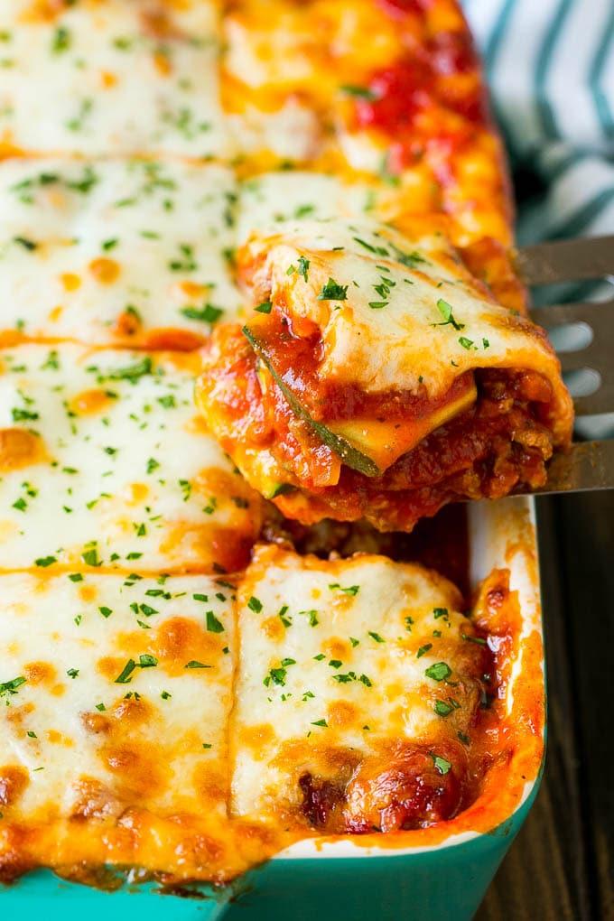 A delicious, golden-brown zucchini lasagna, showing layers of zucchini, cheese, and sauce.