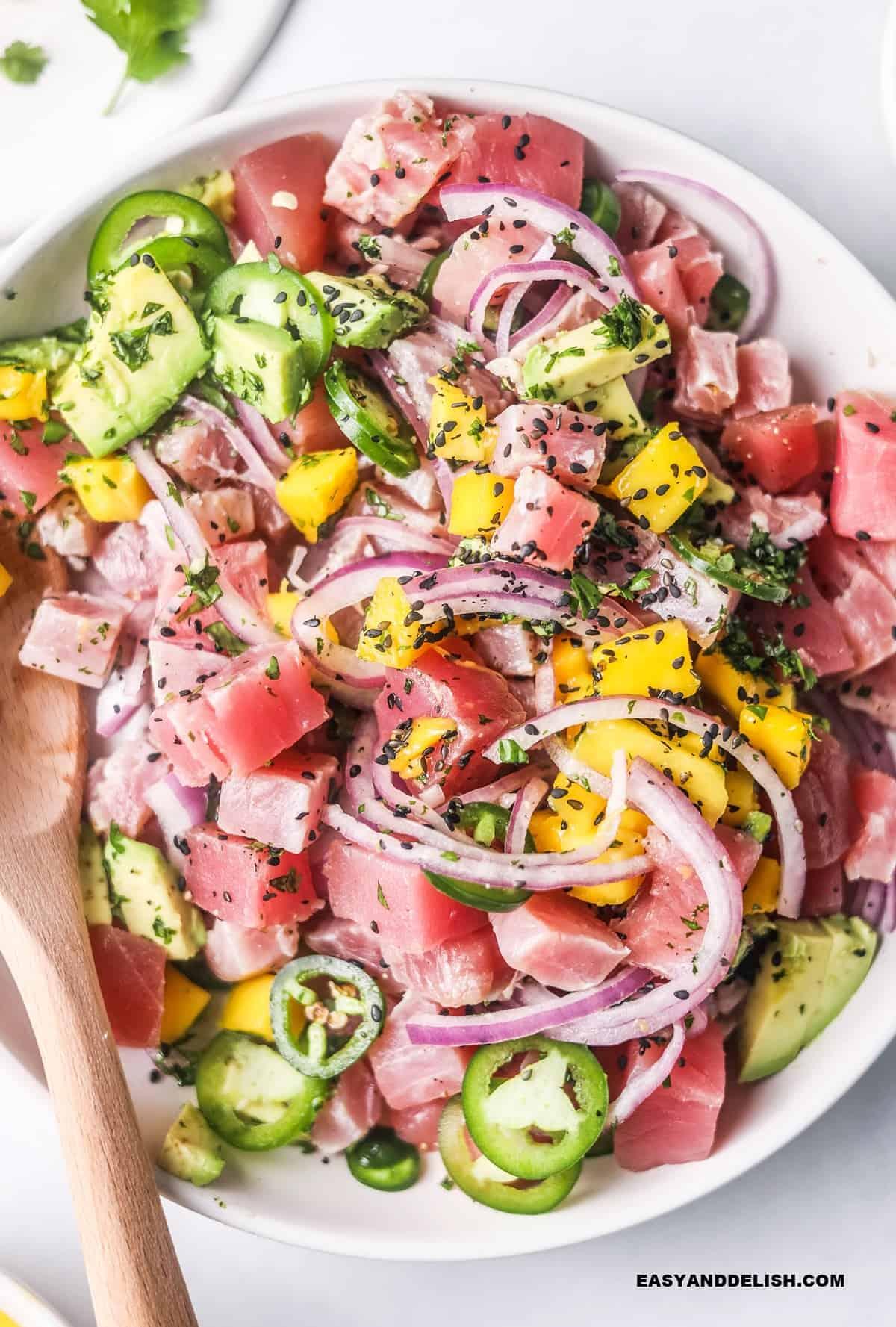 Close-up shot of a vibrant bowl of ceviche, highlighting the fresh fish and chilies.