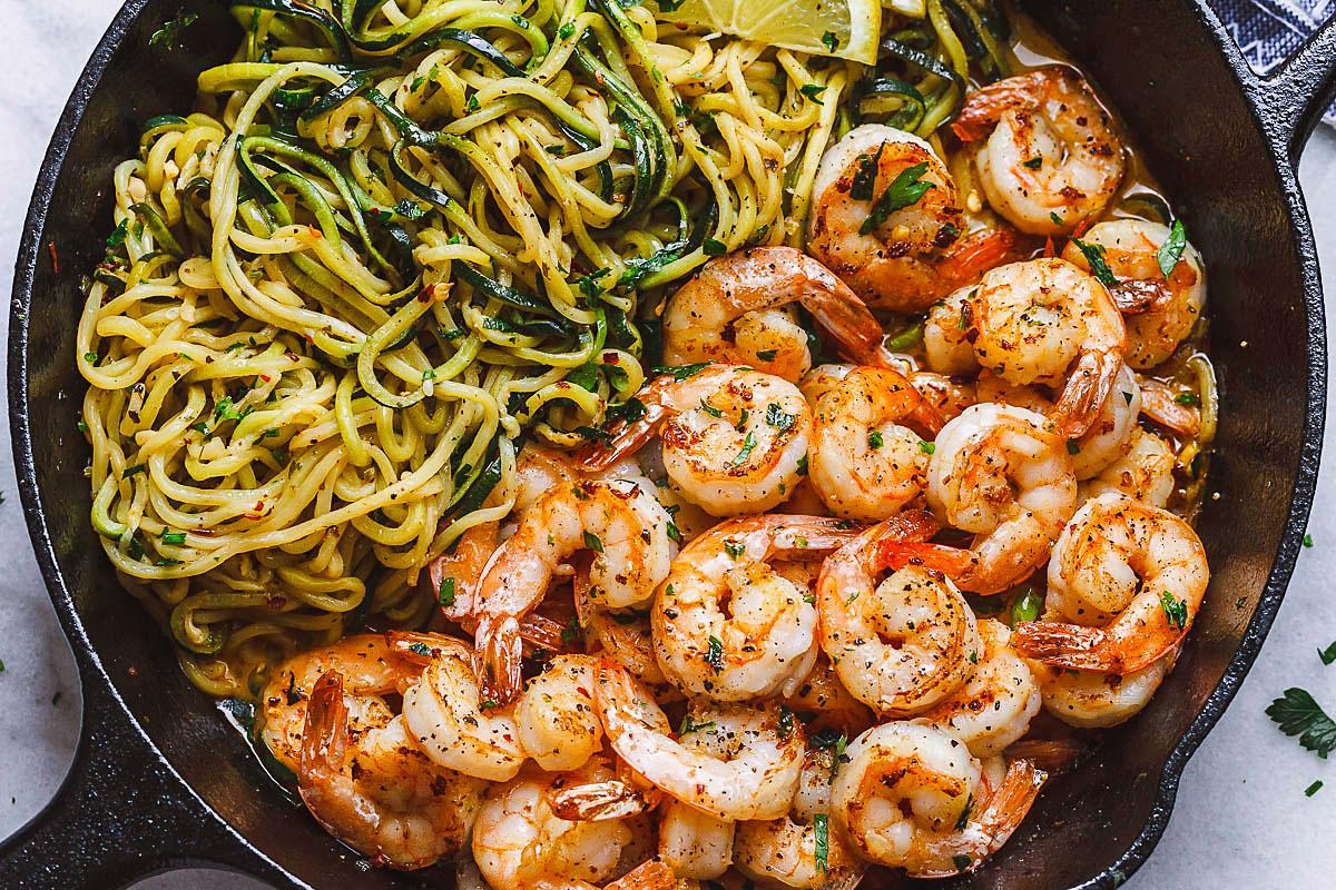 lemon-garlic shrimp kebabs with zucchini noodles on a grill