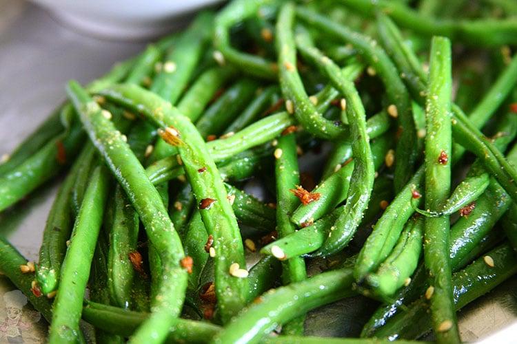 plated steamed velvet beans with ginger garlic and sesame seeds