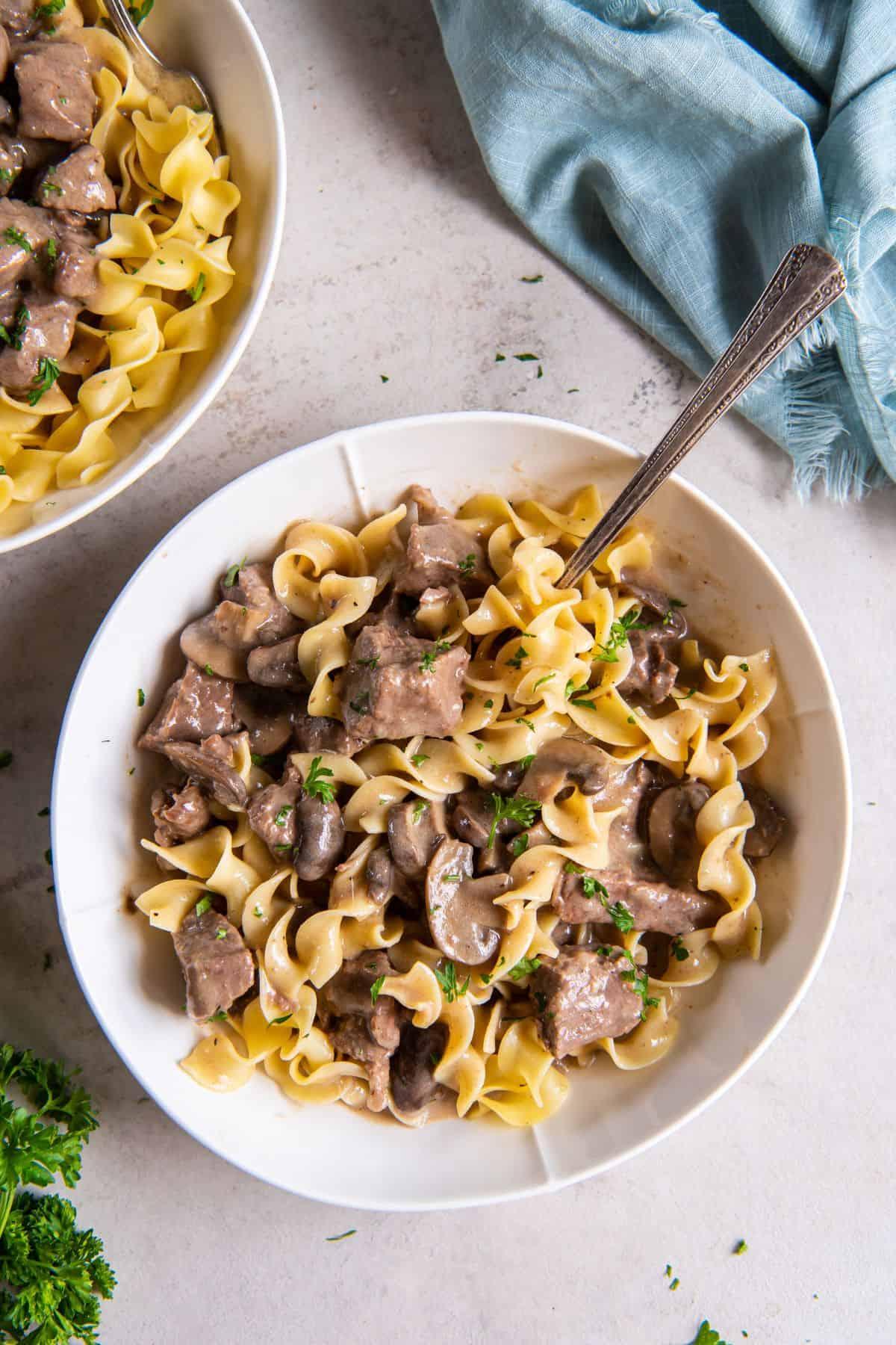 A family enjoying a meal of Instant Pot beef stroganoff