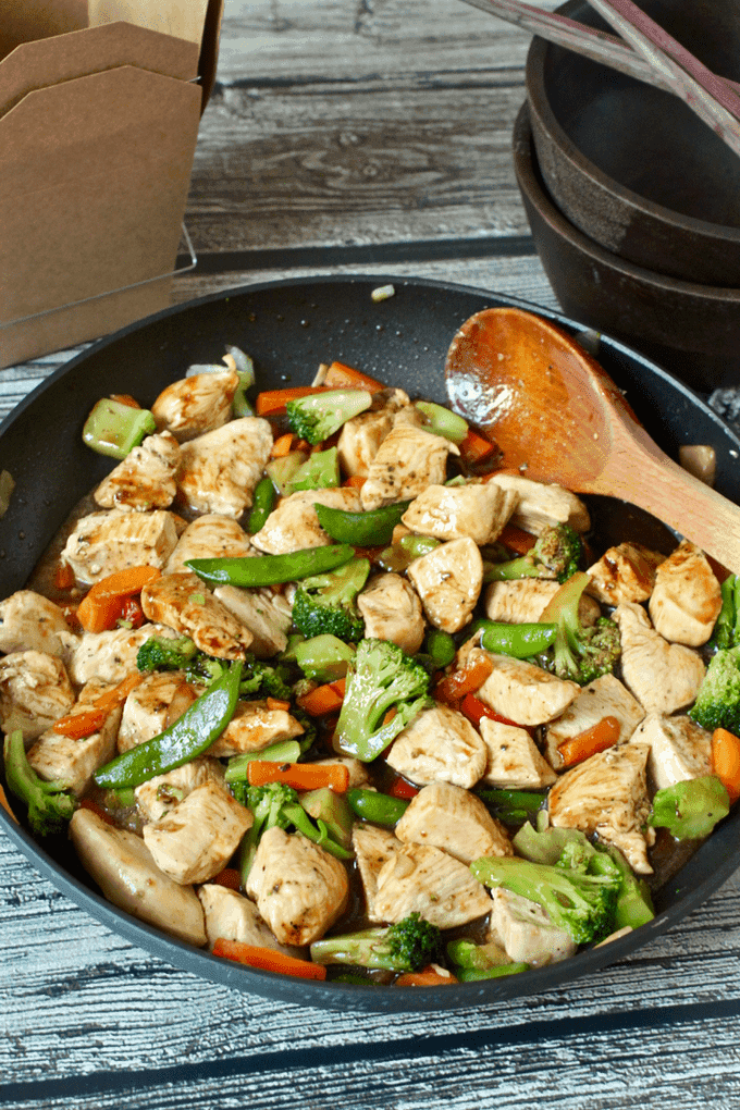 A family enjoying Chicken Stir-fry around a table